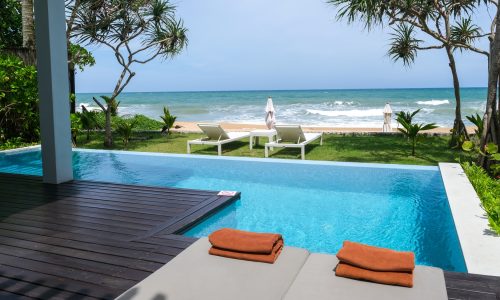 Modern house with a swimming pool, modern pool villa at the beach